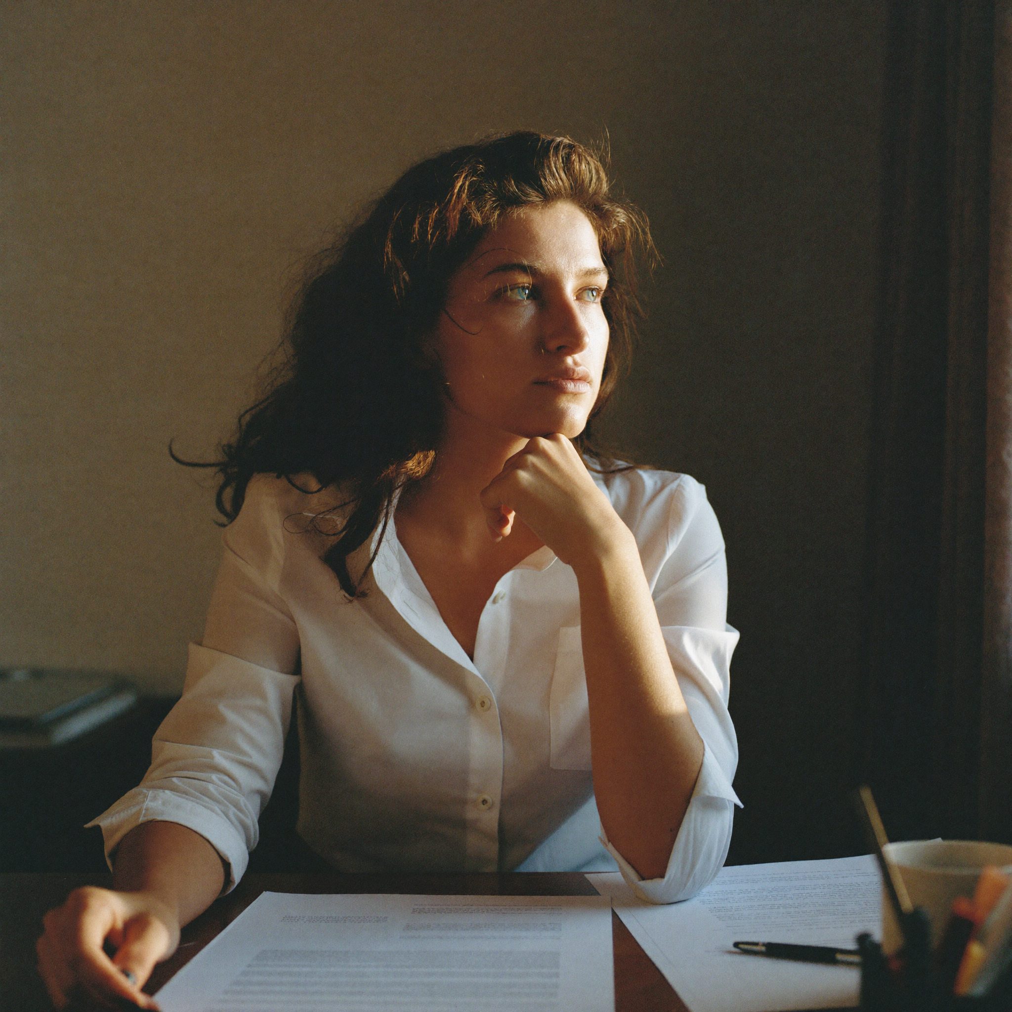 A client sitting thoughtfully at a desk